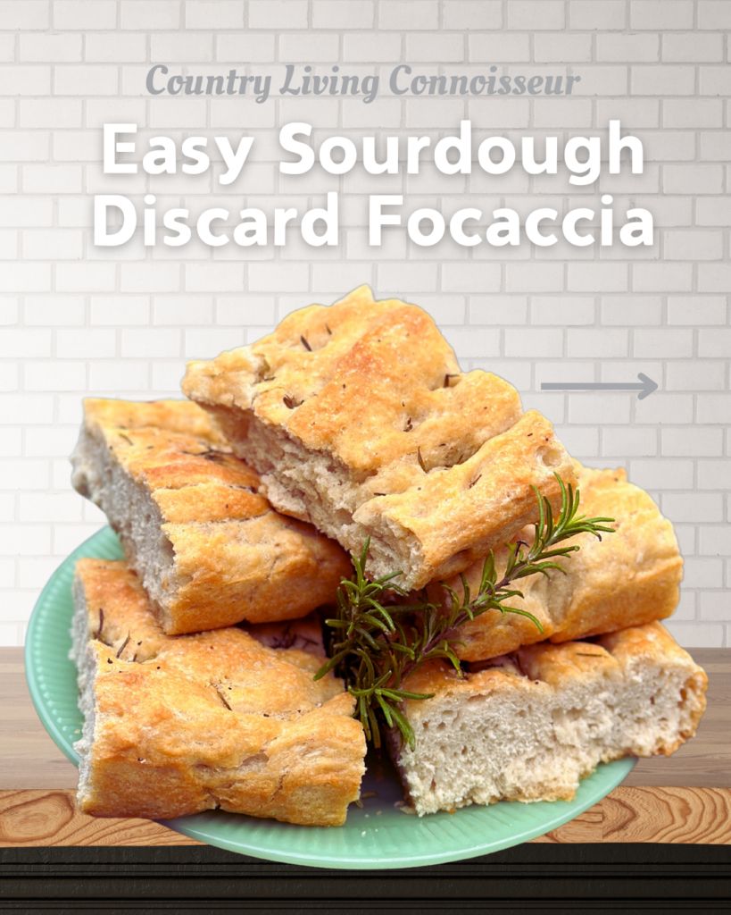 Squares of sourdough discard focaccia stacked on a plate with fresh rosemary