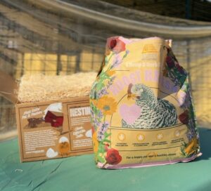 Eaton Pet and Pasture Roost Refresh and Nesting Pads in natural packaging sitting on top of chicken coop