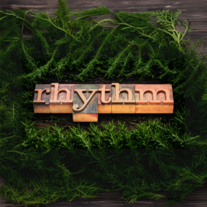 image of block print letters spelling out rhythm on a bed of rosemary. Talking about lifes rhythms.