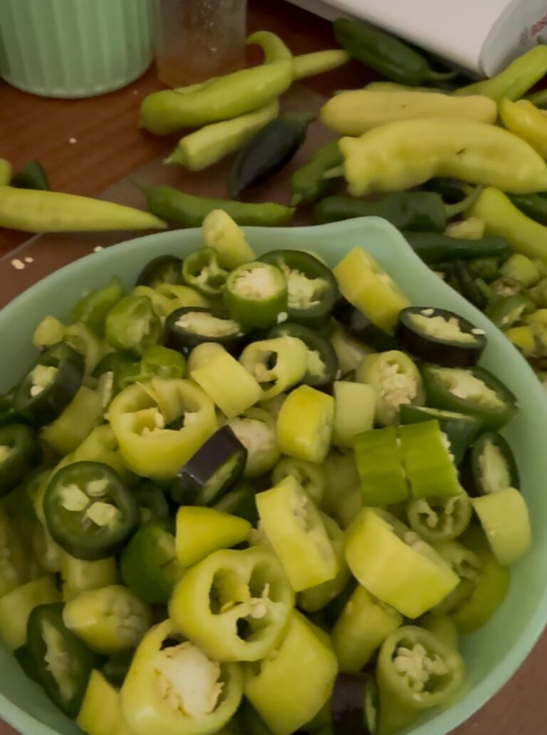 Bowl of sliced banana peppers and jalapenos ready for cowboy candy