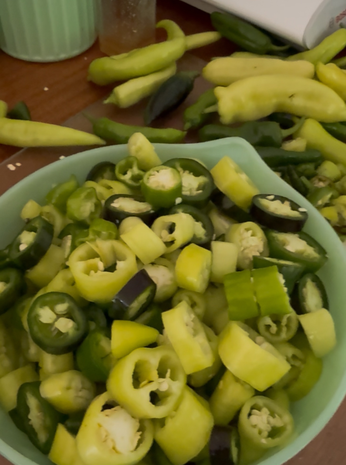 Bowl of sliced banana peppers and jalapenos ready for cowboy candy