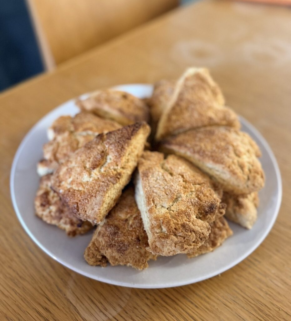 Sourdough discard scones cut into wedges on a plate