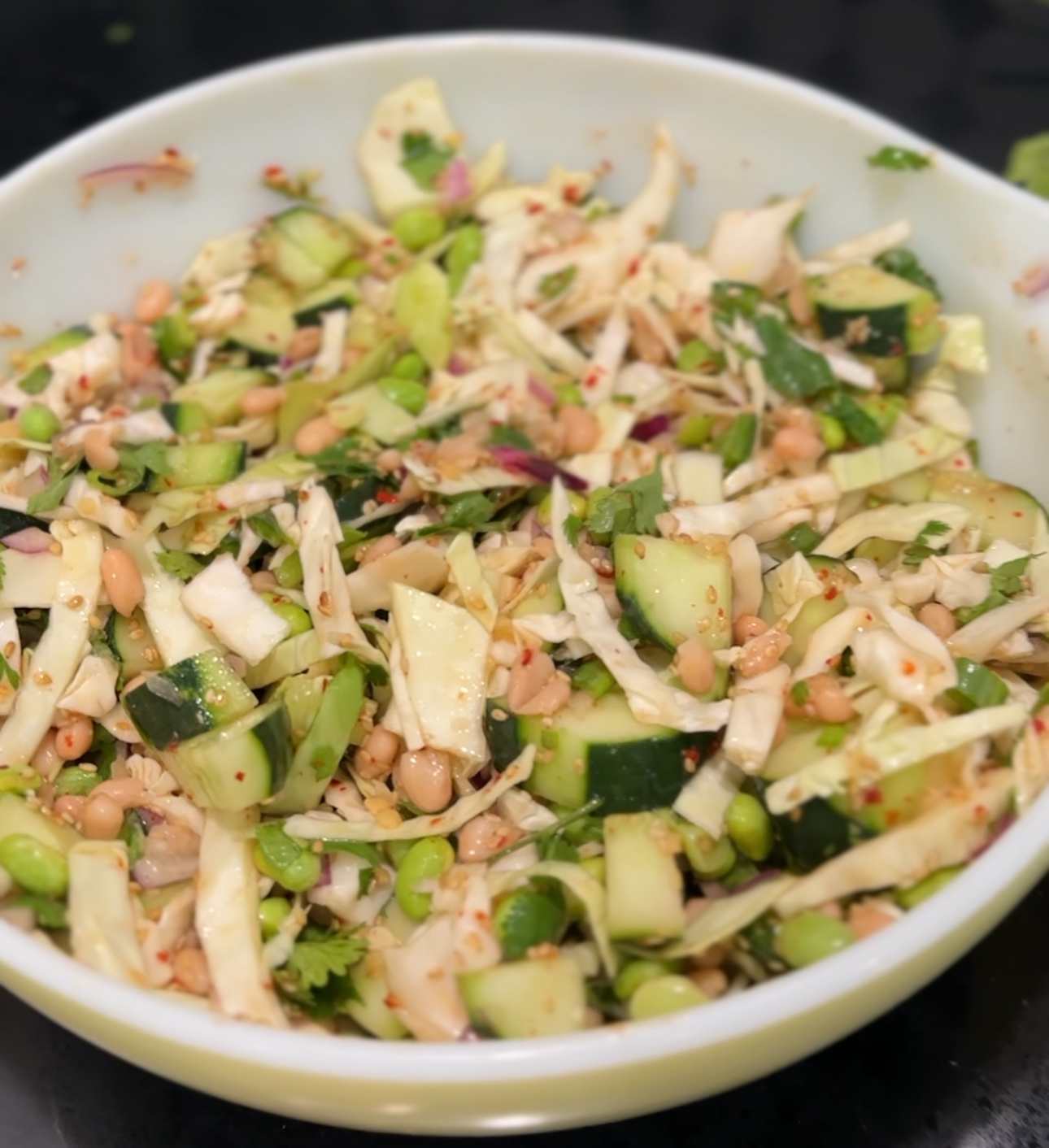 Bowl of white bean and edamame Asian cucumber salad